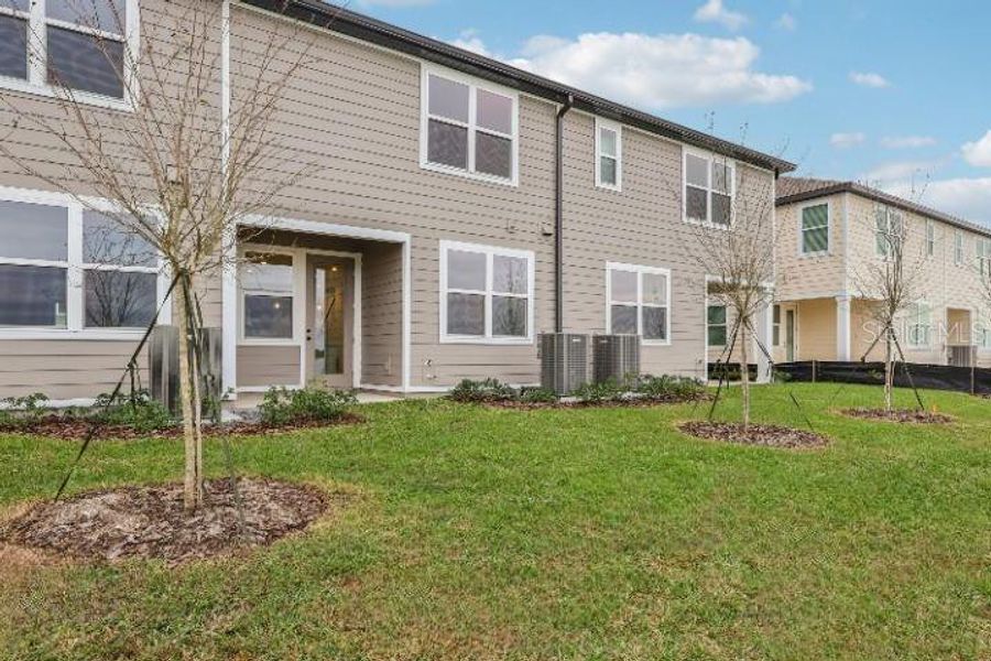 Exterior details and patio area of a home in Catamaran Cove Townhomes, Rockledge (Image 19).