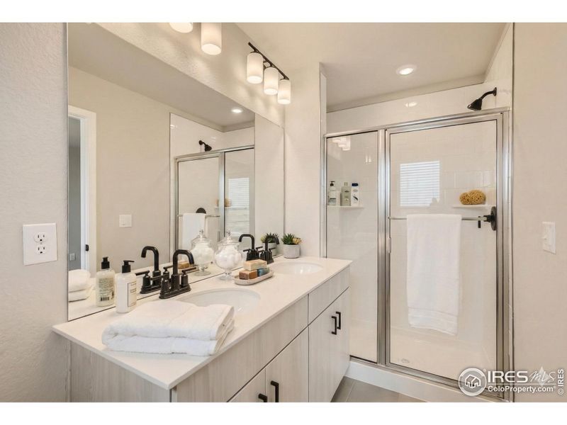 Primary bathroom with dual vanity Primary bathroom with dual vanity