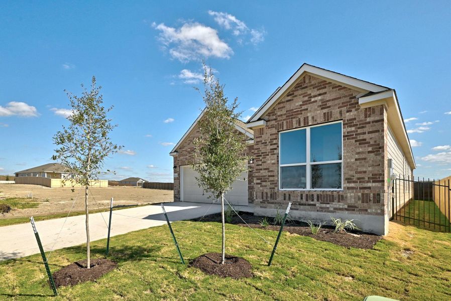 Front exterior of a new home in Stoney Chase, Del Valle, TX, highlighting curb appeal (Image 21).