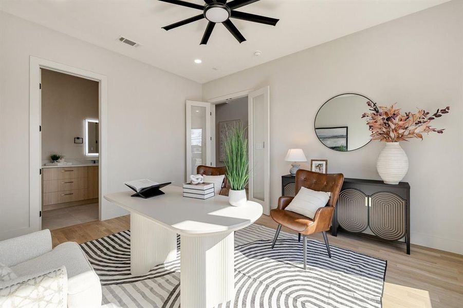 Office area featuring light hardwood / wood-style floors and ceiling fan