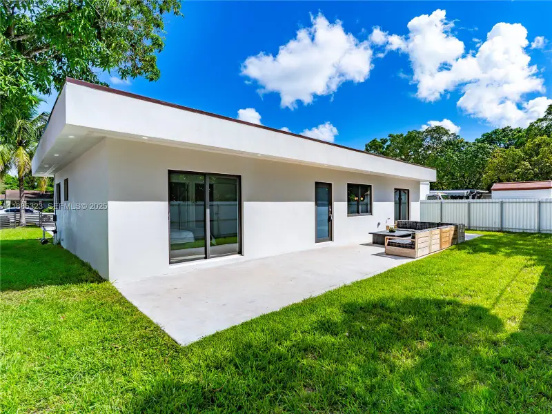 Exterior details and patio area of a home in , North Miami (Image 1).