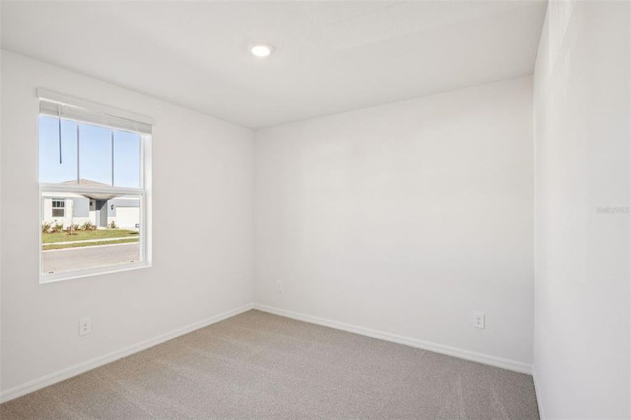 Spacious, unfurnished interior of a new home in The Grove at Stuart Crossing - Classic Series, Bartow (Image 31).