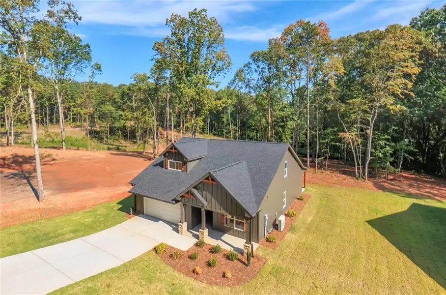 Front exterior of a new home in , Bremen, GA, highlighting curb appeal (Image 1). Front exterior of a new home in , Bremen, GA, highlighting curb appeal (Image 1).