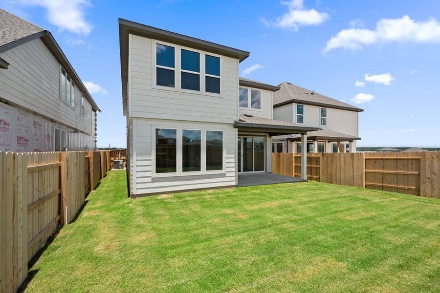 Exterior details and patio area of a home in Lariat, Liberty Hill (Image 30).