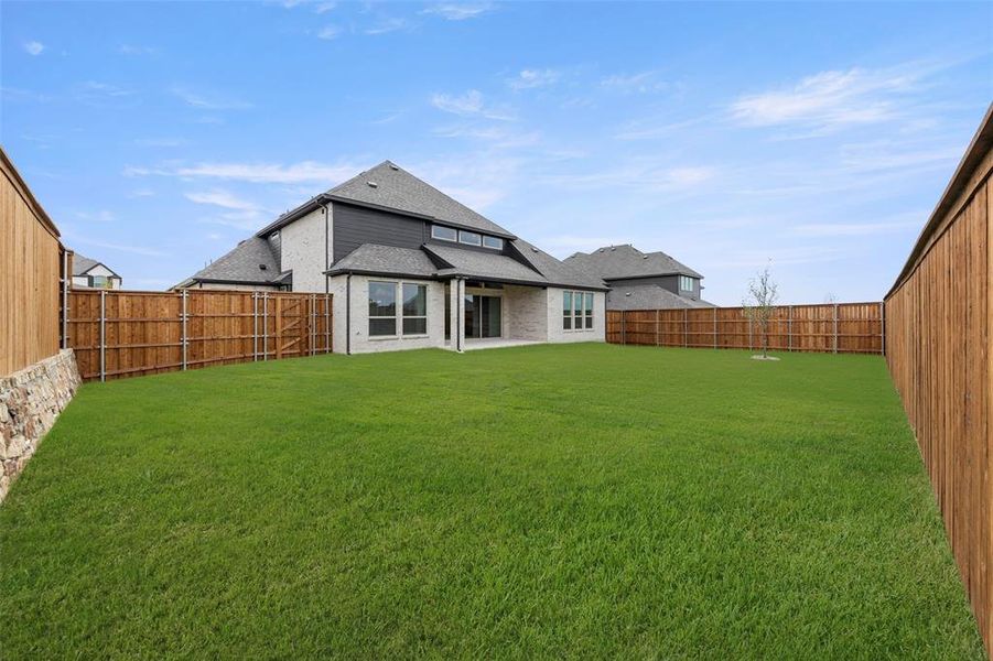 Front exterior of a new home in Cambridge Estates, Prosper, TX, highlighting curb appeal (Image 1).