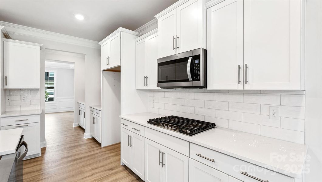 Photo is representative but kitchen cabinets are white