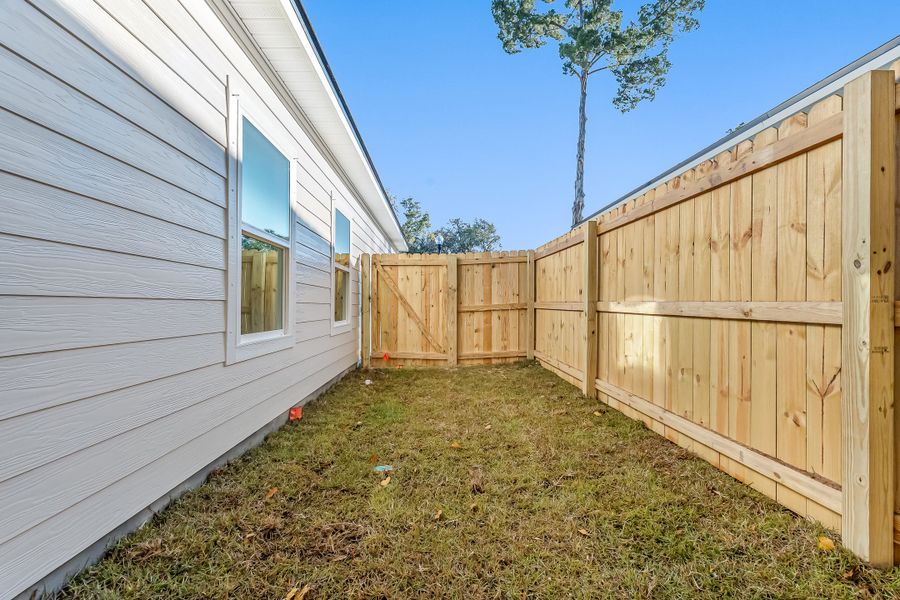 Exterior details and patio area of a home in Live Oak Cottages, Freeport (Image 25). Exterior details and patio area of a home in Live Oak Cottages, Freeport (Image 25).