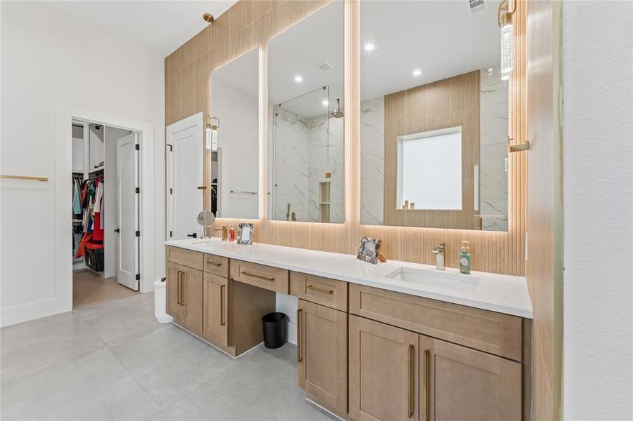 Custom cabinetry with back lit mirrors Custom cabinetry with back lit mirrors