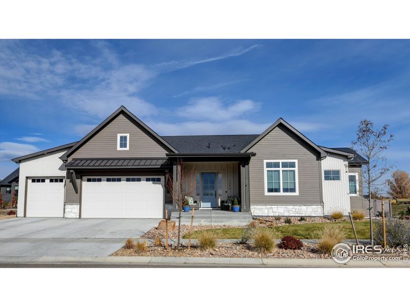 Metal roof accents, fir posts, 3 car oversized garage with insulated steel garage doors and insulated walls Metal roof accents, fir posts, 3 car oversized garage with insulated steel garage doors and insulated walls