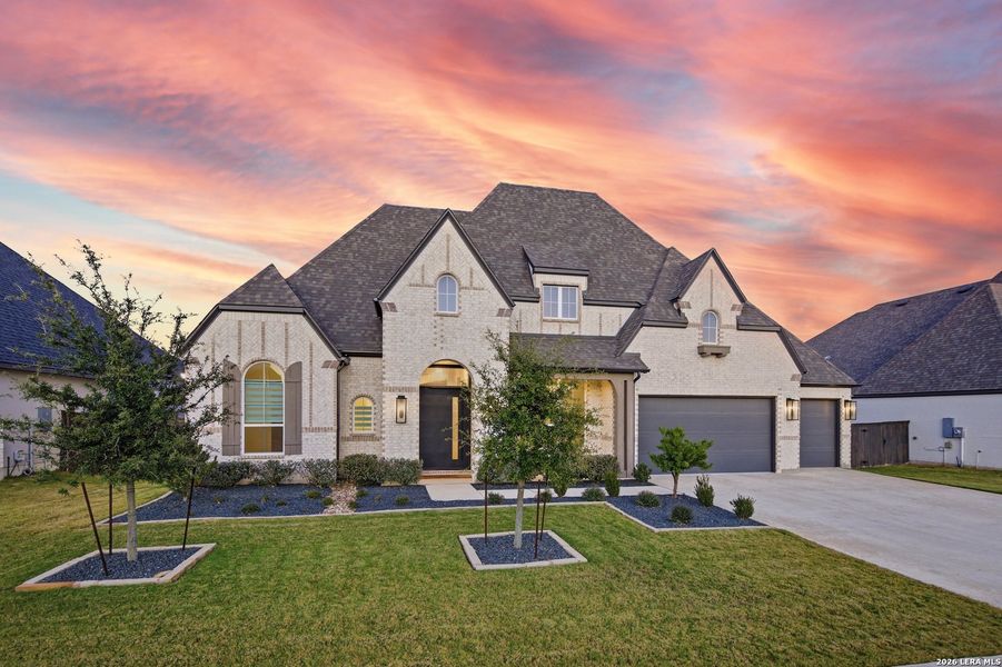 Front exterior of a new home in Mesa Western, Cibolo, TX, highlighting curb appeal (Image 2). Front exterior of a new home in Mesa Western, Cibolo, TX, highlighting curb appeal (Image 2).