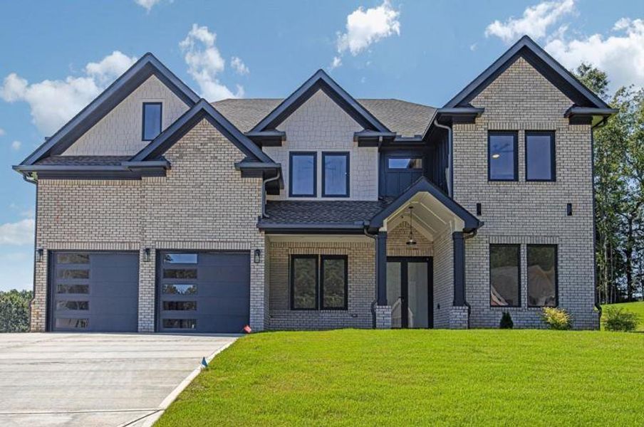Front exterior of a new home in , Auburn, GA, highlighting curb appeal (Image 24).