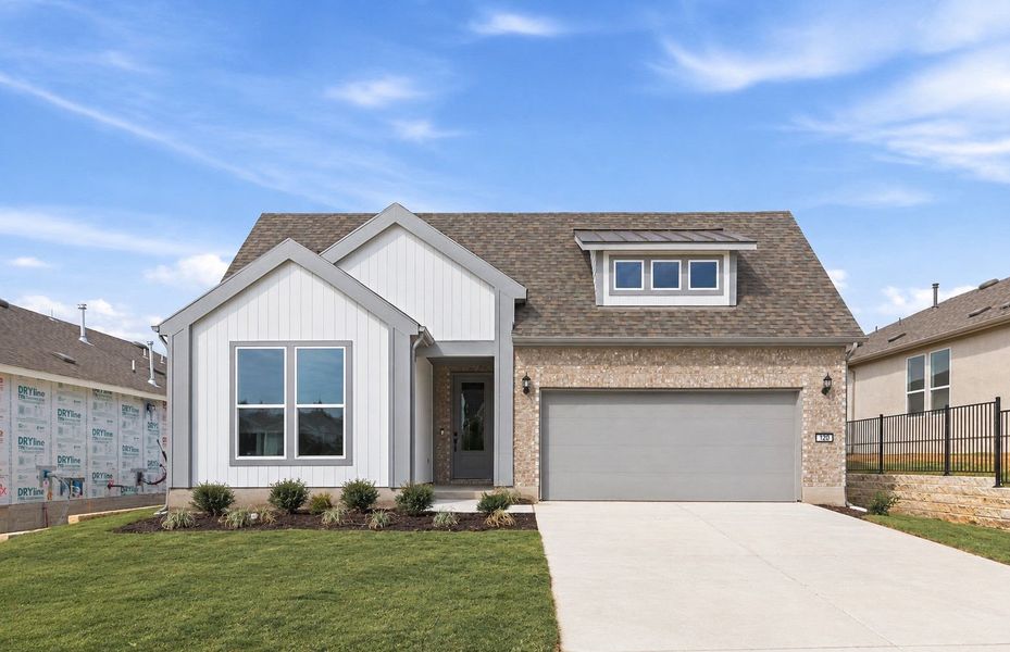 Front exterior of a new home in Sun City Texas, Georgetown, TX, highlighting curb appeal (Image 26). Front exterior of a new home in Sun City Texas, Georgetown, TX, highlighting curb appeal (Image 26).