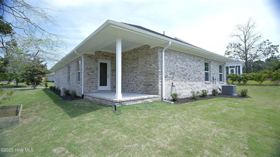 Front exterior of a new home in Palmetto Creek, Bolivia, NC, highlighting curb appeal (Image 13).