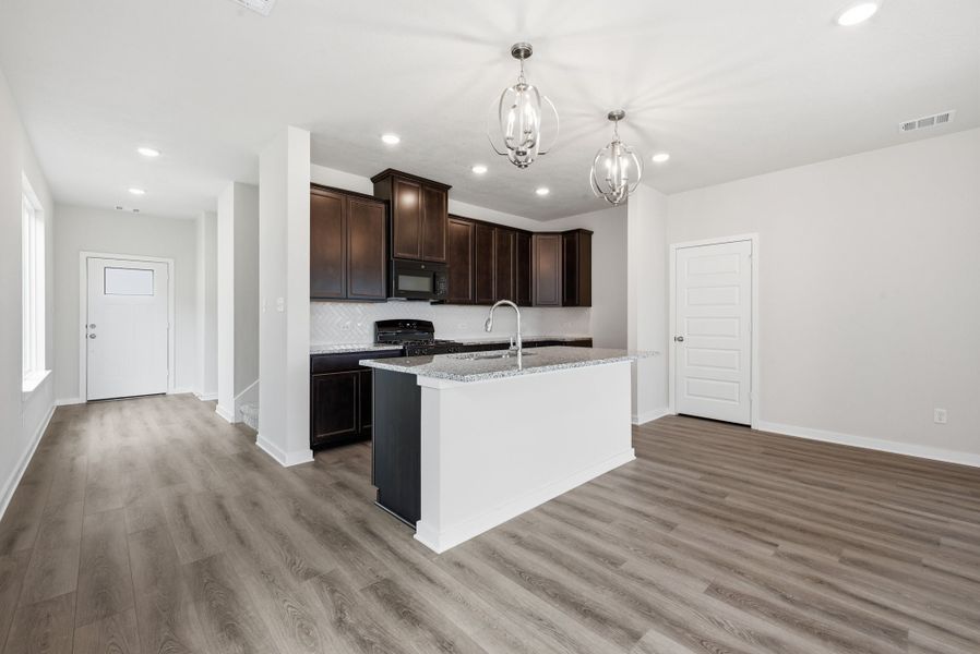 Furnished interior view inside a new home in Heartland at Creek Meadows, College Station (Image 3). Furnished interior view inside a new home in Heartland at Creek Meadows, College Station (Image 3).