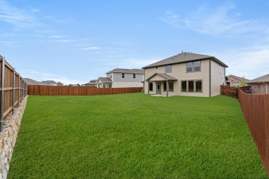 Front exterior of a new home in Waterscape, Royse City, TX, highlighting curb appeal (Image 16). Front exterior of a new home in Waterscape, Royse City, TX, highlighting curb appeal (Image 16).