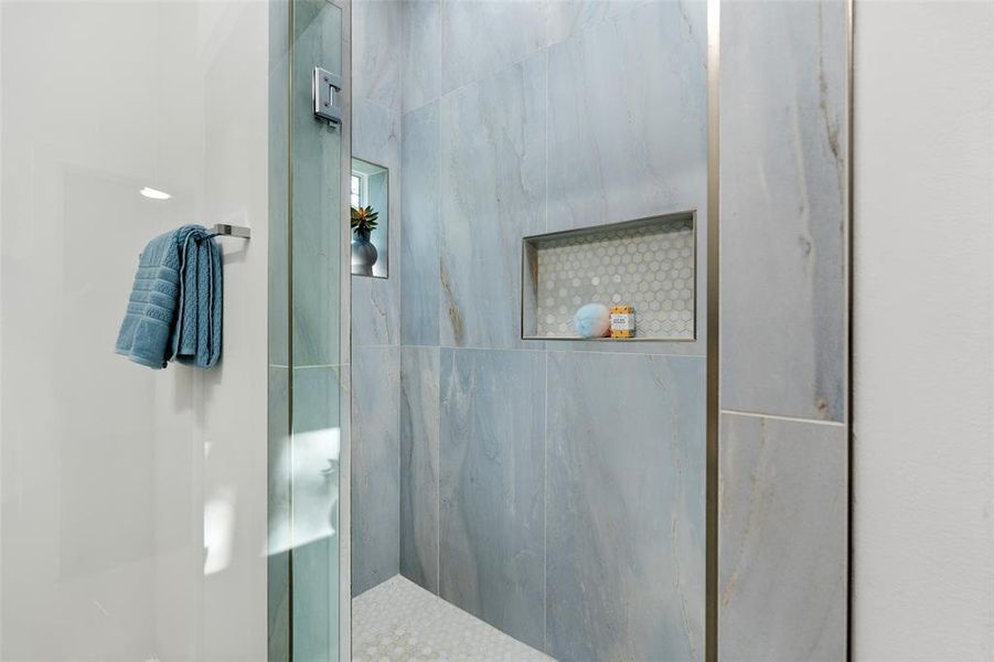 Bathroom featuring a tile shower