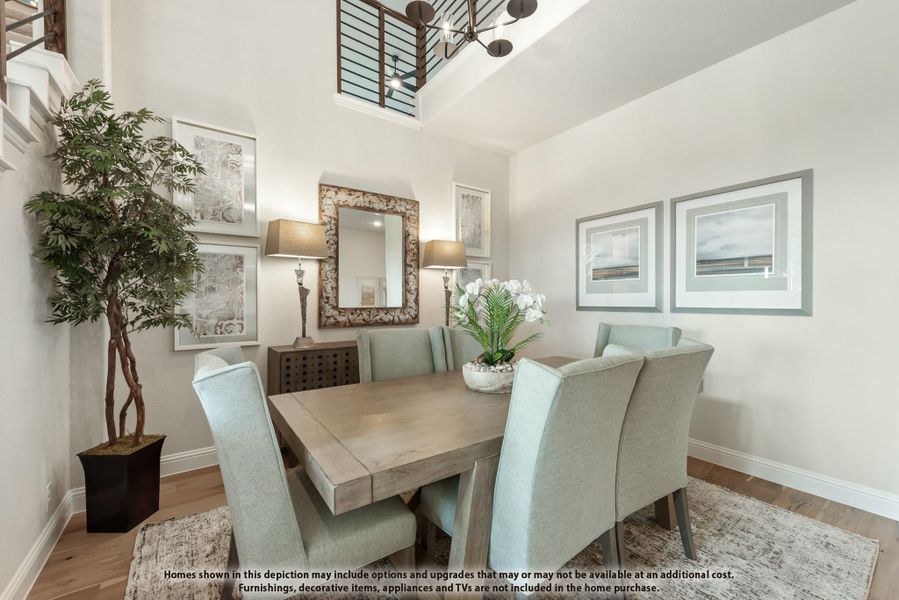 Formal dining room with wood table, light blue chairs, high ceilings, and decorative mirror on white walls Formal dining room with wood table, light blue chairs, high ceilings, and decorative mirror on white walls