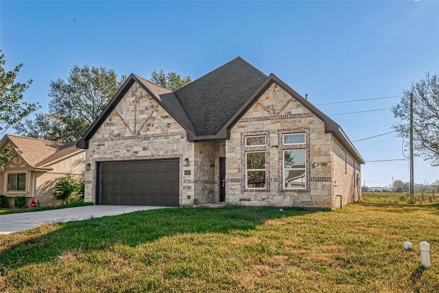 Front exterior of a new home in , Needville, TX, highlighting curb appeal (Image 1). Front exterior of a new home in , Needville, TX, highlighting curb appeal (Image 1).