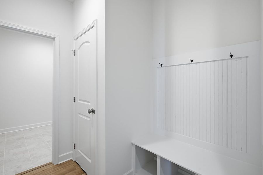 A bathroom with a shower unit and a sink. A bathroom with a shower unit and a sink.