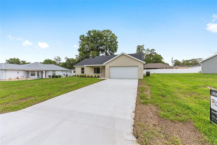 Front exterior of a new home in , Dunnellon, FL, highlighting curb appeal (Image 27). Front exterior of a new home in , Dunnellon, FL, highlighting curb appeal (Image 27).