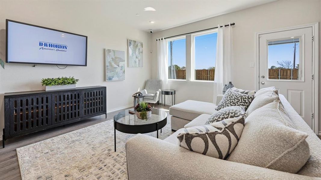 Living room with wood finished floors and recessed lighting Living room with wood finished floors and recessed lighting
