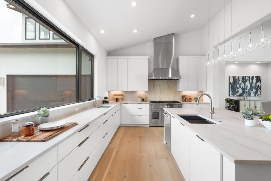 Culinary excellence meets sleek design in this open-concept kitchen with top-tier appliances.