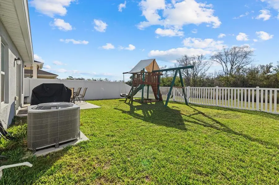 Exterior details and patio area of a home in , Parrish (Image 3).