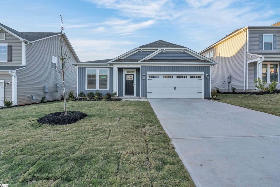 Front exterior of a new home in Halton Oaks, Spartanburg, SC, highlighting curb appeal (Image 2). Front exterior of a new home in Halton Oaks, Spartanburg, SC, highlighting curb appeal (Image 2).