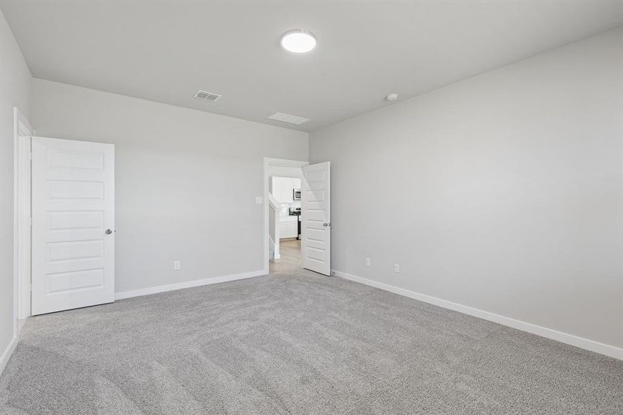 Primary Suite in the Holden home plan by Trophy Signature Homes – REPRESENTATIVE PHOTO Primary Suite in the Holden home plan by Trophy Signature Homes – REPRESENTATIVE PHOTO
