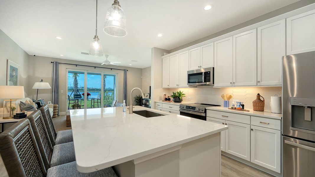 Representative furnished interior of a home built from the Avery by Neal Communities in SkySail, Naples (Image 12).