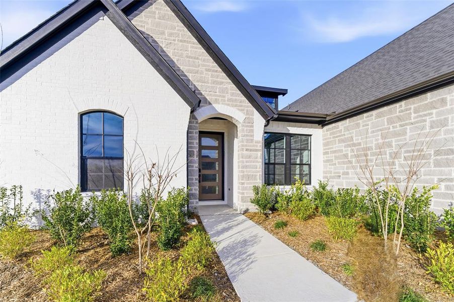 Doorway to property with brick siding