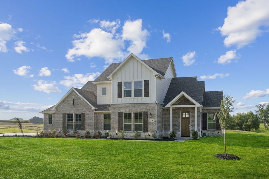 Front exterior of a new home in Lakeway Estates, Waxahachie, TX, highlighting curb appeal (Image 2). Front exterior of a new home in Lakeway Estates, Waxahachie, TX, highlighting curb appeal (Image 2).