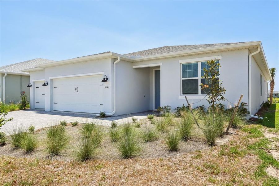 Exterior details and patio area of a home in Crescent Lakes - Signature Series, Punta Gorda (Image 15).