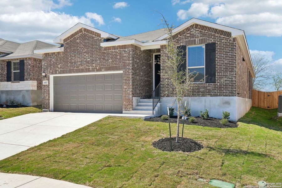 Front exterior of a new home in Comanche Ridge, San Antonio, TX, highlighting curb appeal (Image 17). Front exterior of a new home in Comanche Ridge, San Antonio, TX, highlighting curb appeal (Image 17).