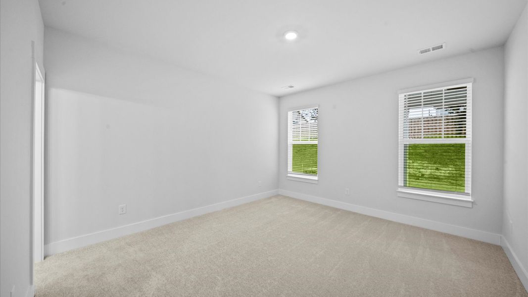 Eye-catching details and elegant finishes in the vibrant primary suite of this select home Eye-catching details and elegant finishes in the vibrant primary suite of this select home