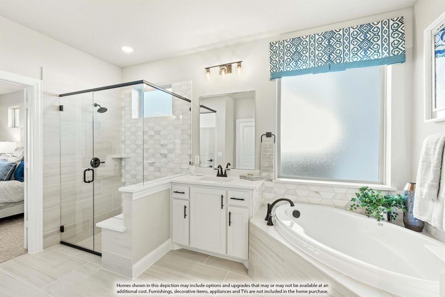 Master bathroom with glass walk-in shower, soaking tub, white vanity, and decorative tile walls Master bathroom with glass walk-in shower, soaking tub, white vanity, and decorative tile walls