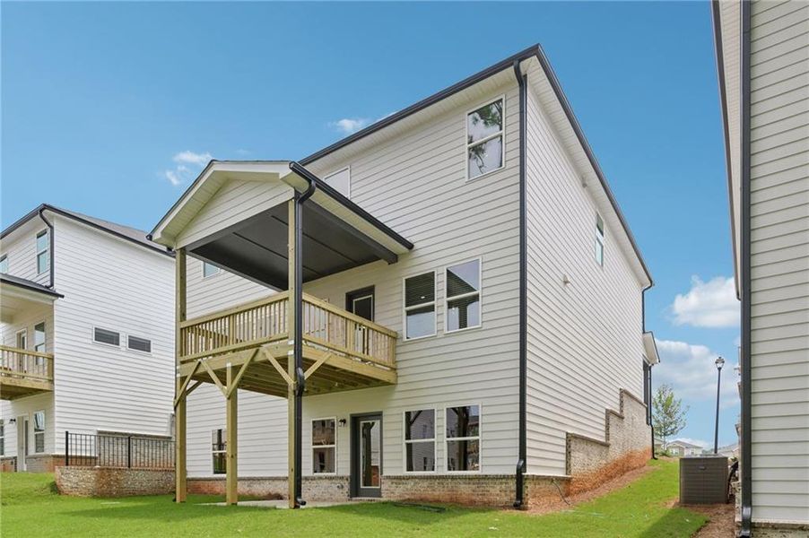 Exterior details and patio area of a home in Martin Springs - Estate Series, Lawrenceville (Image 32).