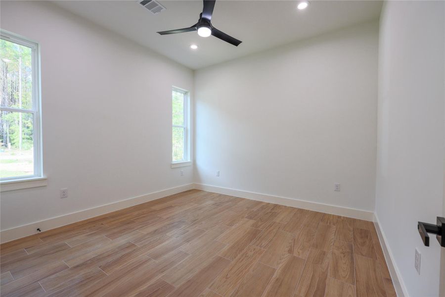 Bedroom with walk in closet with space for clothes and even built in custom shoe racks. Bedroom with walk in closet with space for clothes and even built in custom shoe racks.