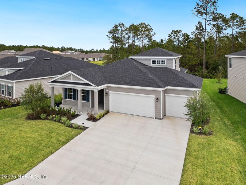 Front exterior of a new home in Seminole Palms Single-Family Homes, Palm Coast, FL, highlighting curb appeal (Image 25).