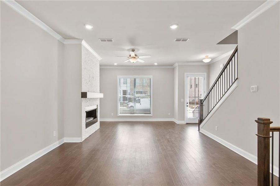 The dining area is centrally located between the kitchen and family room. Photos are not of the exact property but are similar, the home is currently under construction.