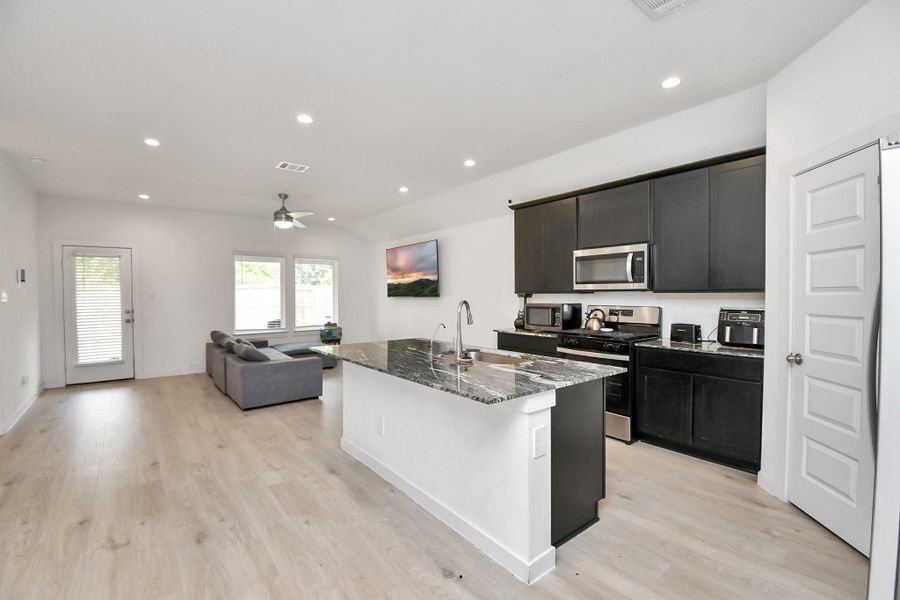 Furnished interior view inside a new home in Post Oak Pointe, Fresno (Image 5).