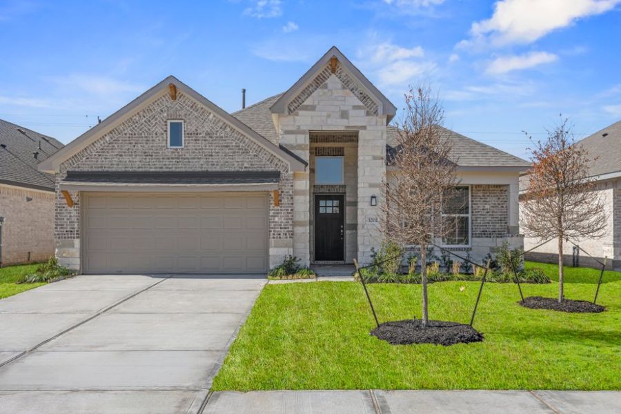 Front exterior of a new home in Ashland, Houston, TX, highlighting curb appeal (Image 18).