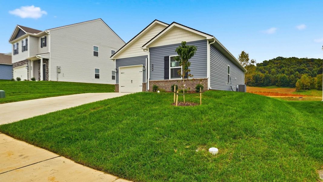 Front exterior of a new home in Fieldcrest Acres, Blountville, TN, highlighting curb appeal (Image 20). Front exterior of a new home in Fieldcrest Acres, Blountville, TN, highlighting curb appeal (Image 20).