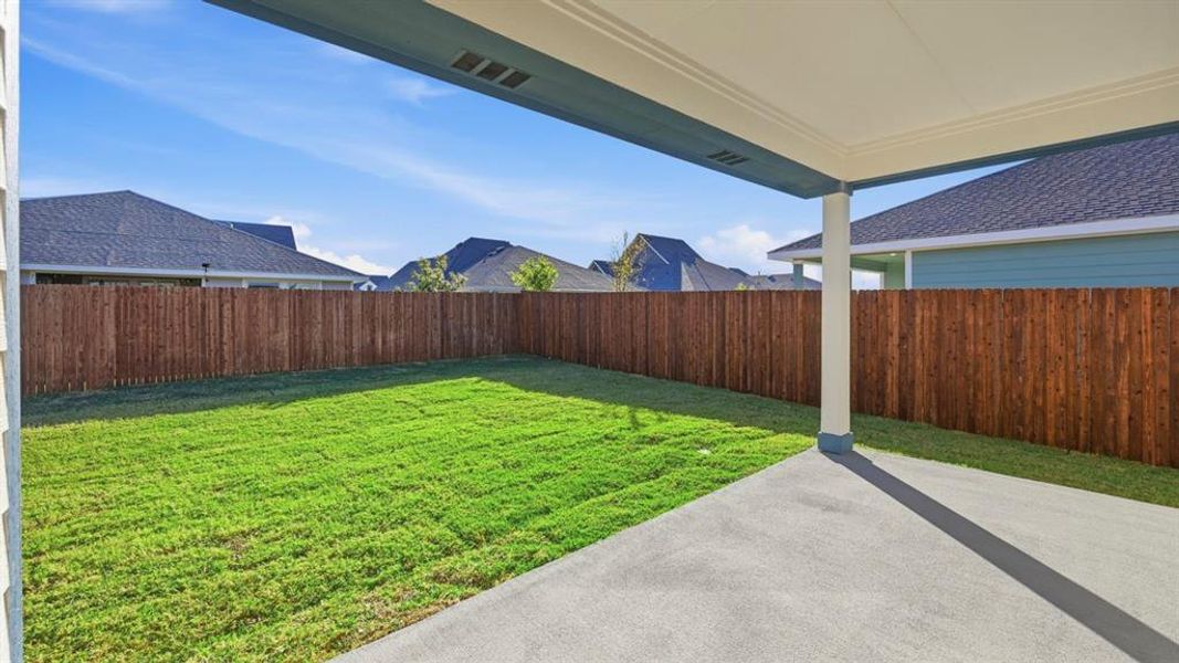 Fenced backyard featuring a patio Fenced backyard featuring a patio