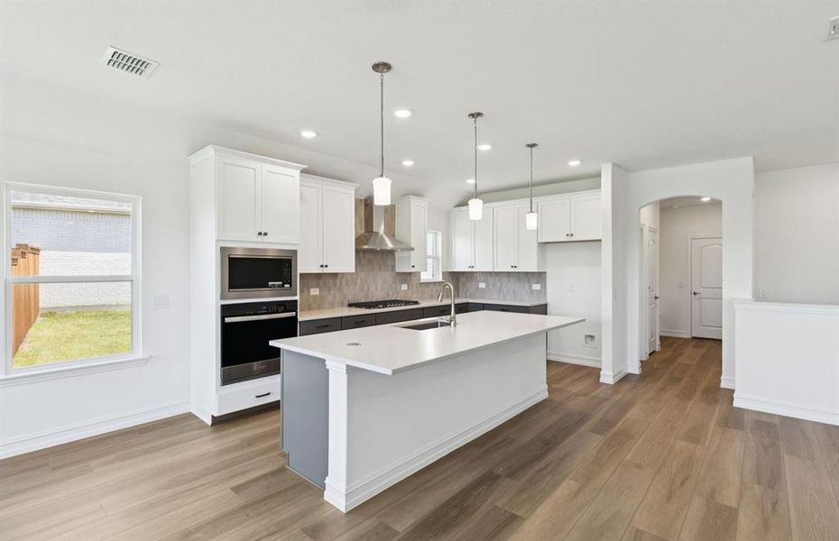 Spacious kitchen with eat-in bartop island Spacious kitchen with eat-in bartop island