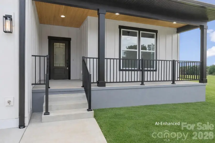 Front porch view. The ceilings are wooden