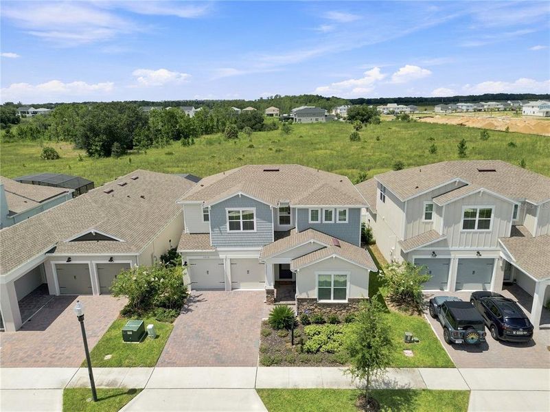 Front exterior of a new home in Horizon Isle, Winter Garden, FL, highlighting curb appeal (Image 27). Front exterior of a new home in Horizon Isle, Winter Garden, FL, highlighting curb appeal (Image 27).