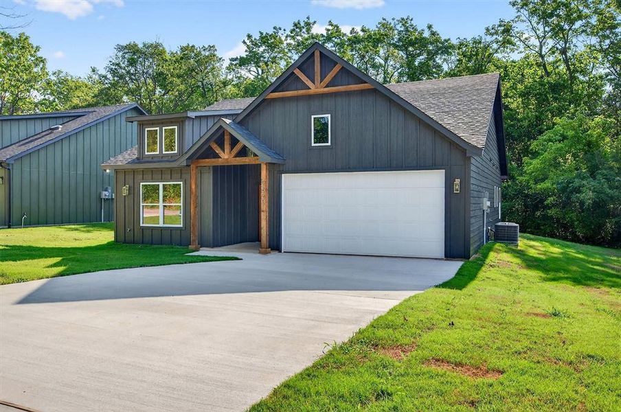 Front exterior of a new home in , Denison, TX, highlighting curb appeal (Image 22). Front exterior of a new home in , Denison, TX, highlighting curb appeal (Image 22).