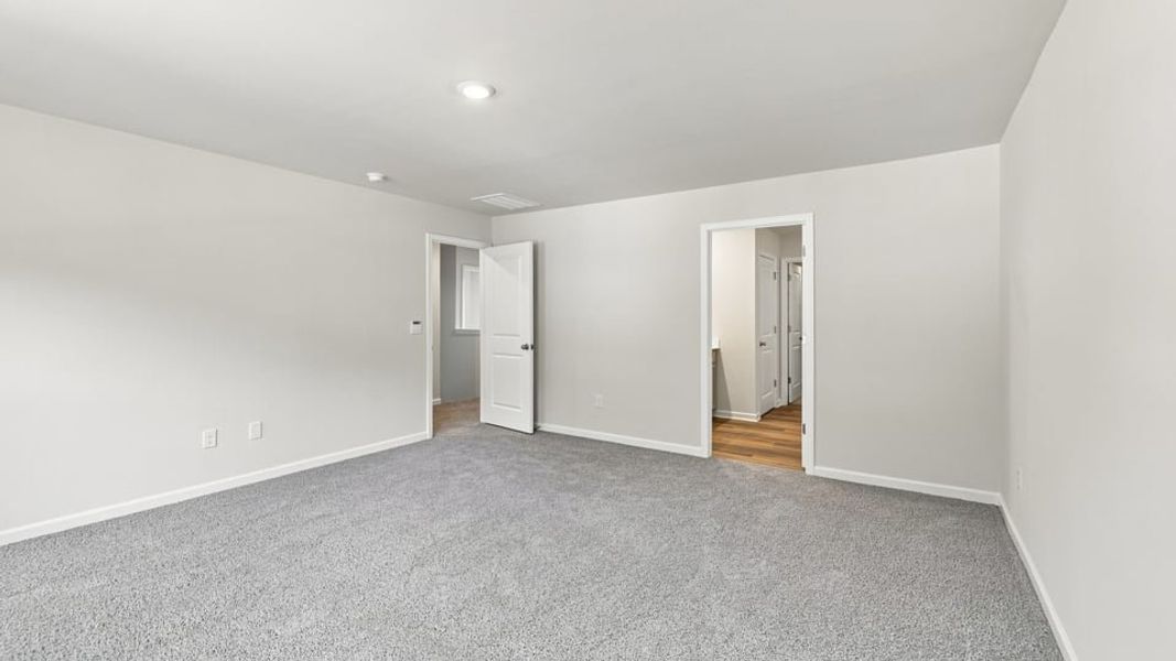 Spacious, unfurnished interior of a new home in Bentley Park, Greenwood (Image 31).