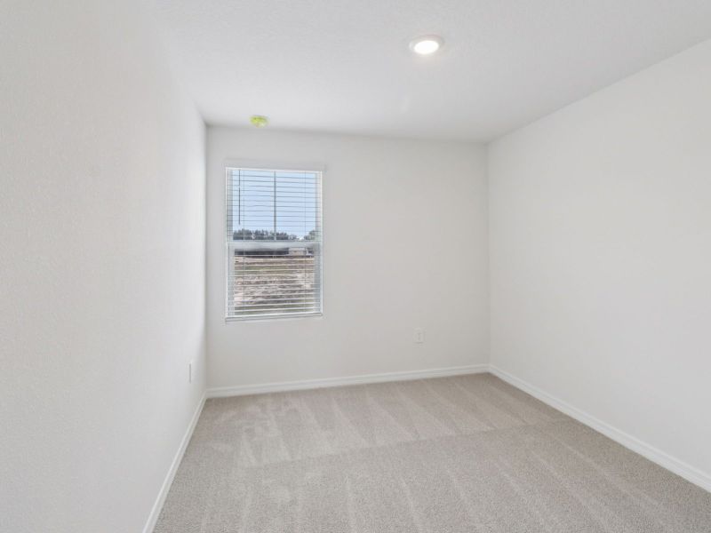 Spacious, unfurnished interior of a new home in The Reserve at Hammock Oaks Townes, Lady Lake (Image 9).